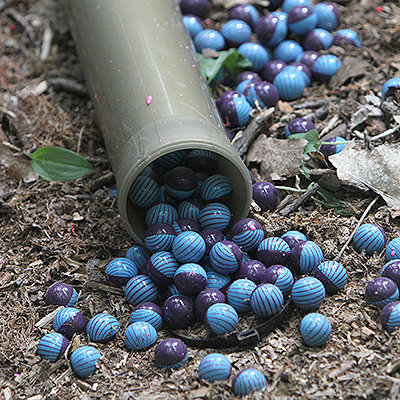 Valken Graffiti Paintballs in paintball pod on the ground 